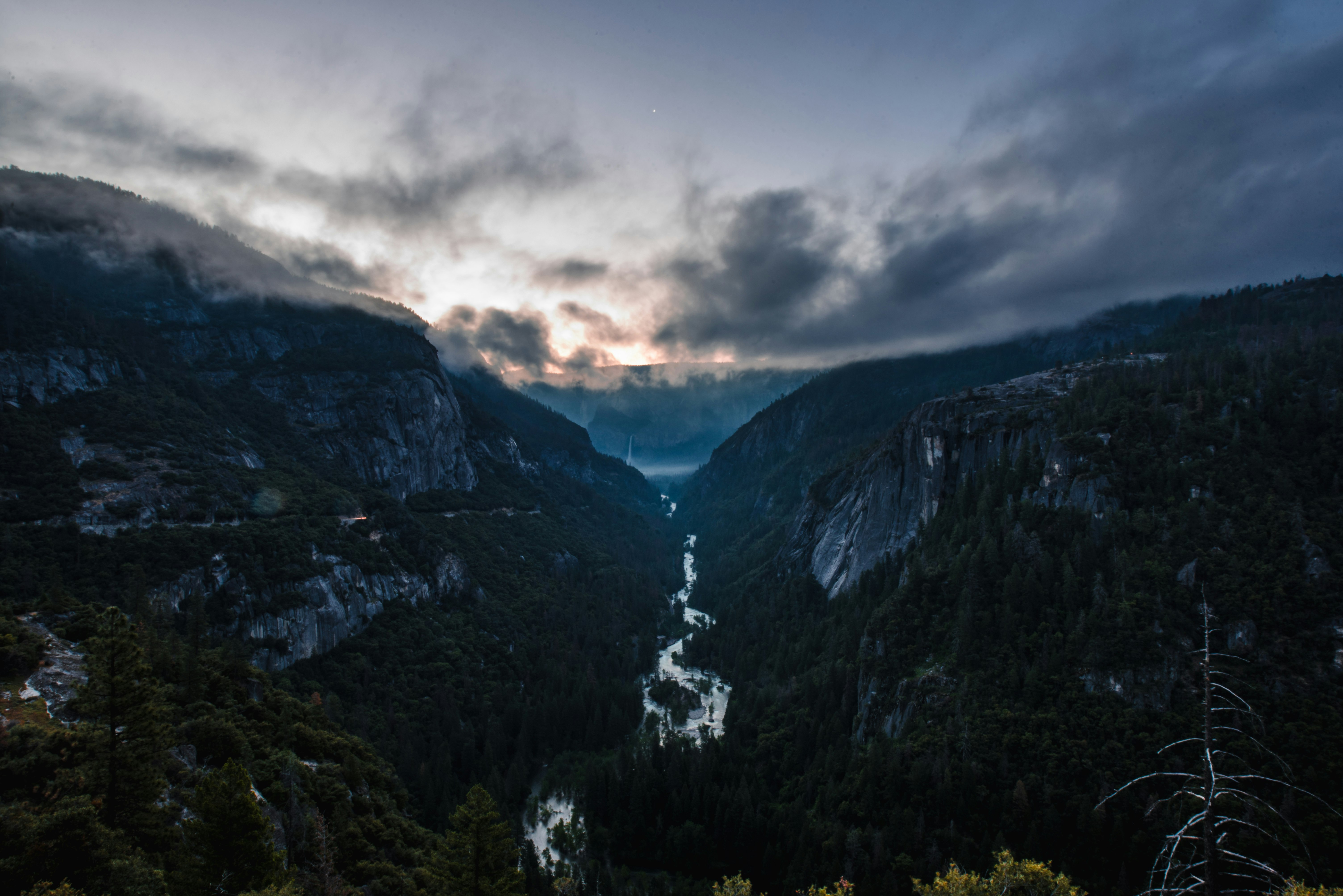 aerial photography of river between mountains